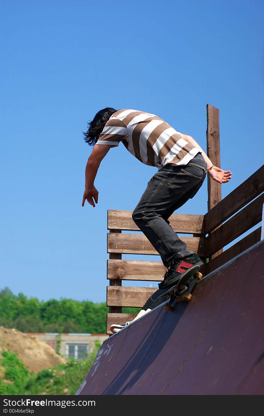 Skateboarder in a mini ramp