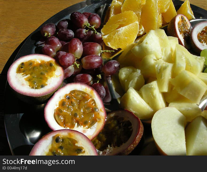 A large plate of assorted Tropical fruit. A large plate of assorted Tropical fruit