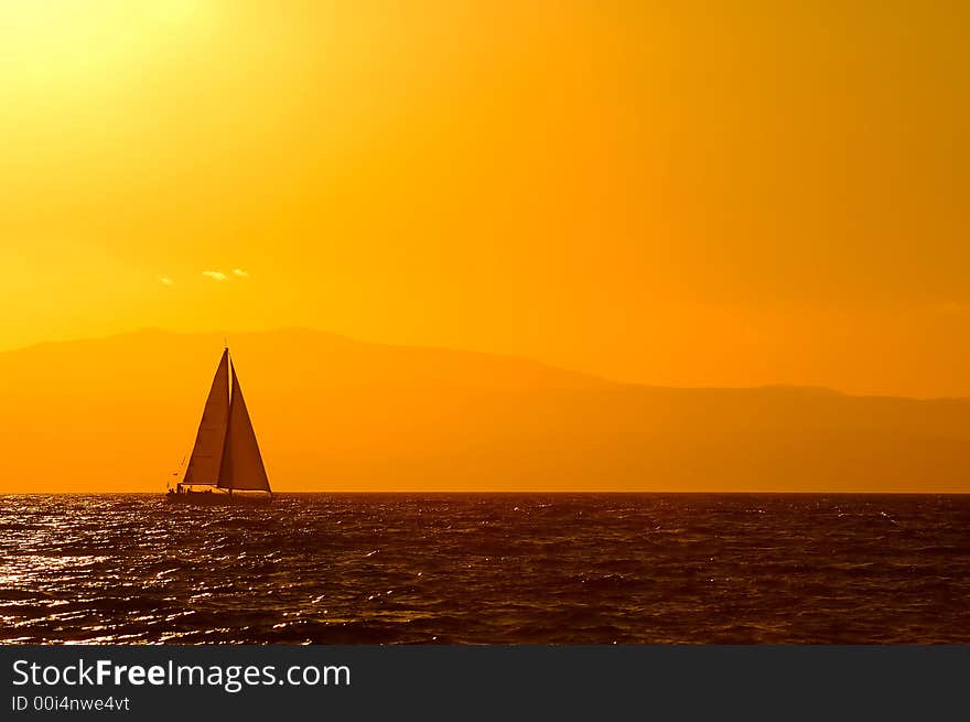 A sailing boat traveling the Mediterranean