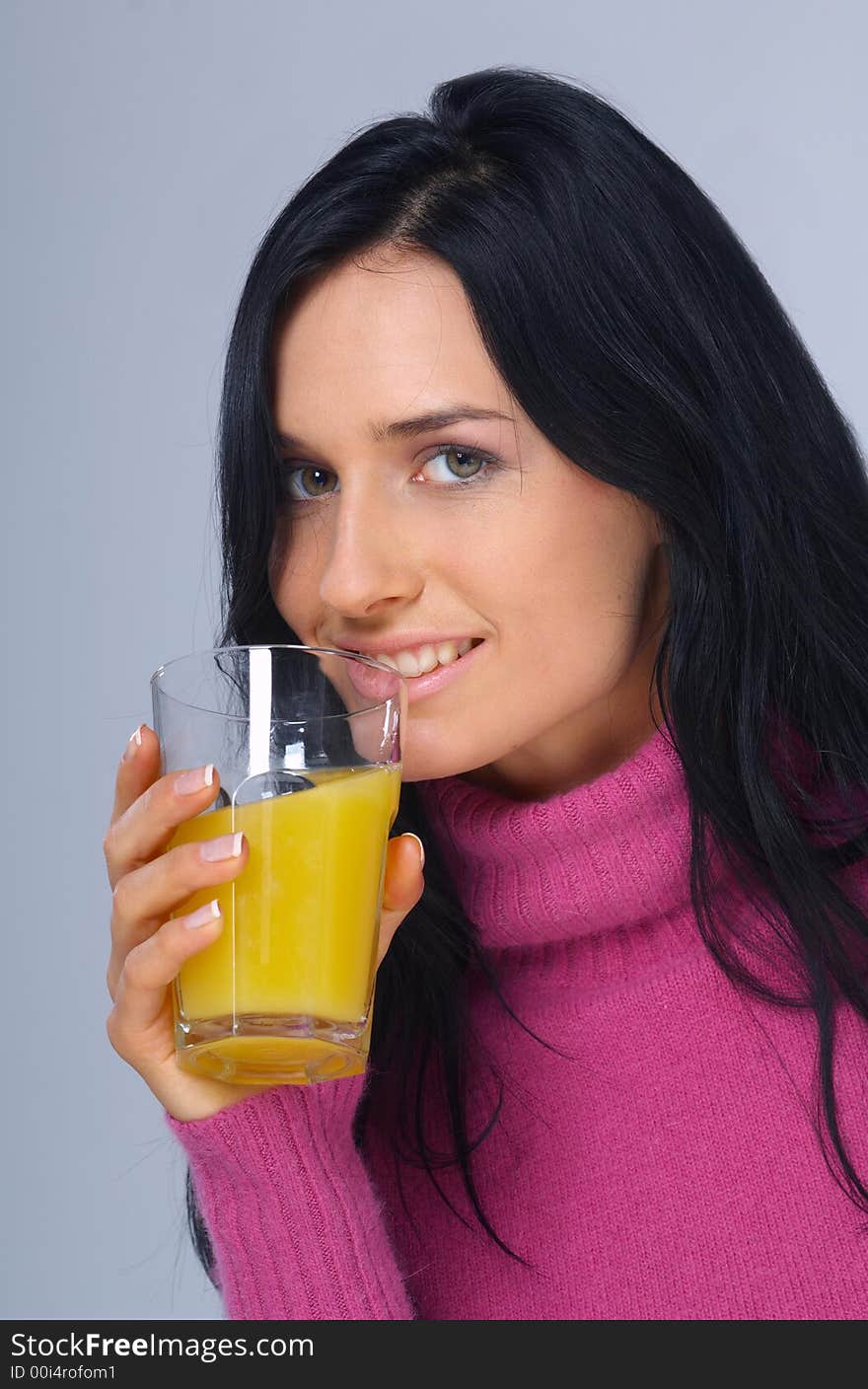 Pretty woman with orange juice