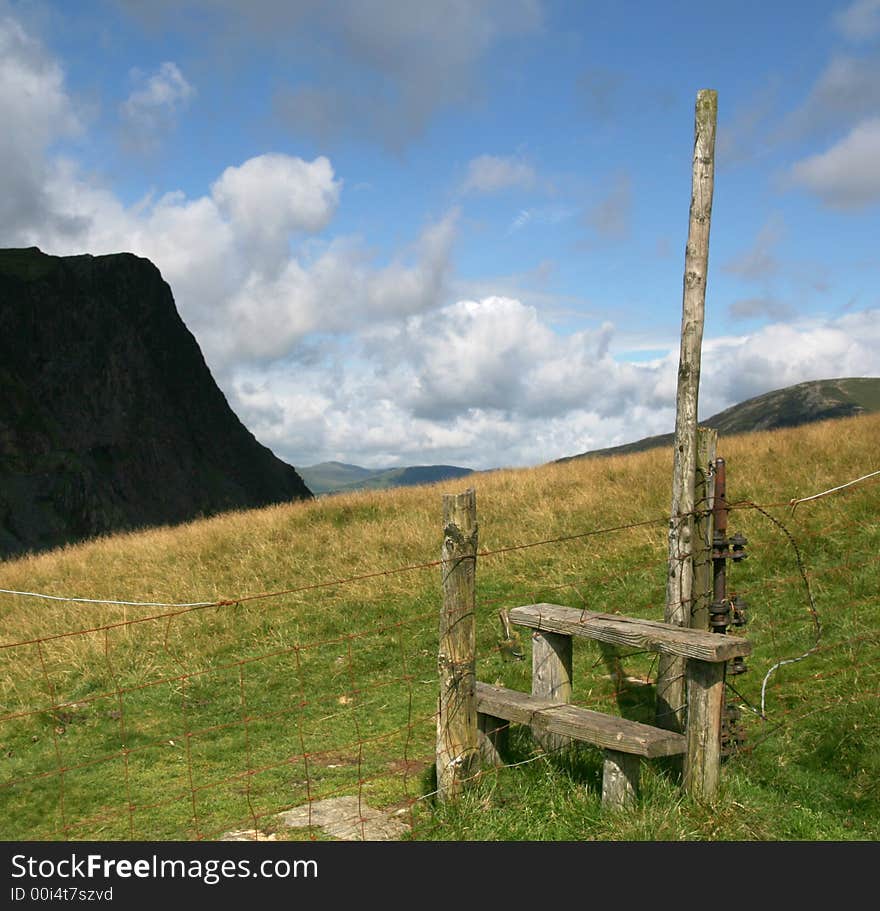 A stile across a wire fence in the English Lake district