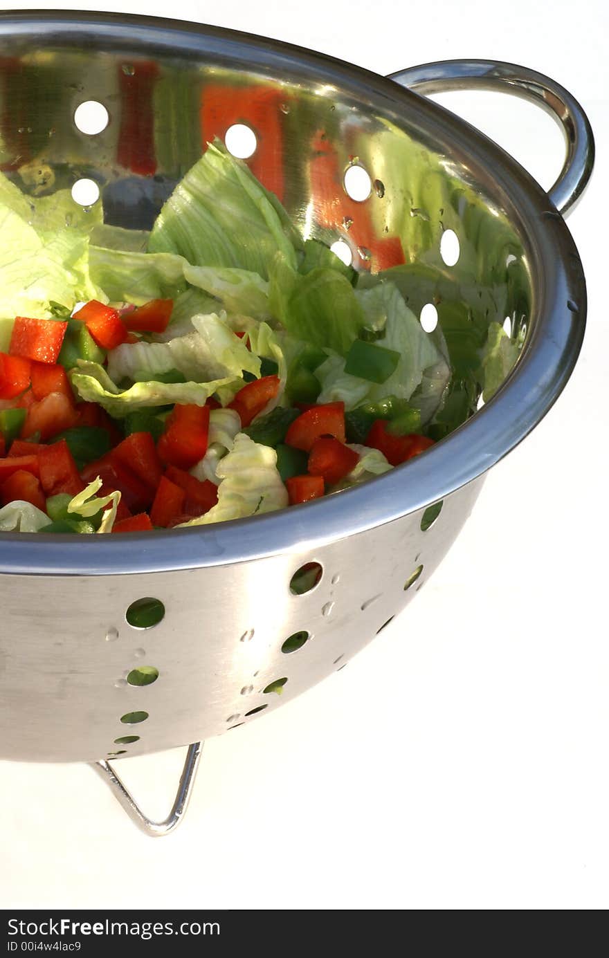 Salad in strainer.