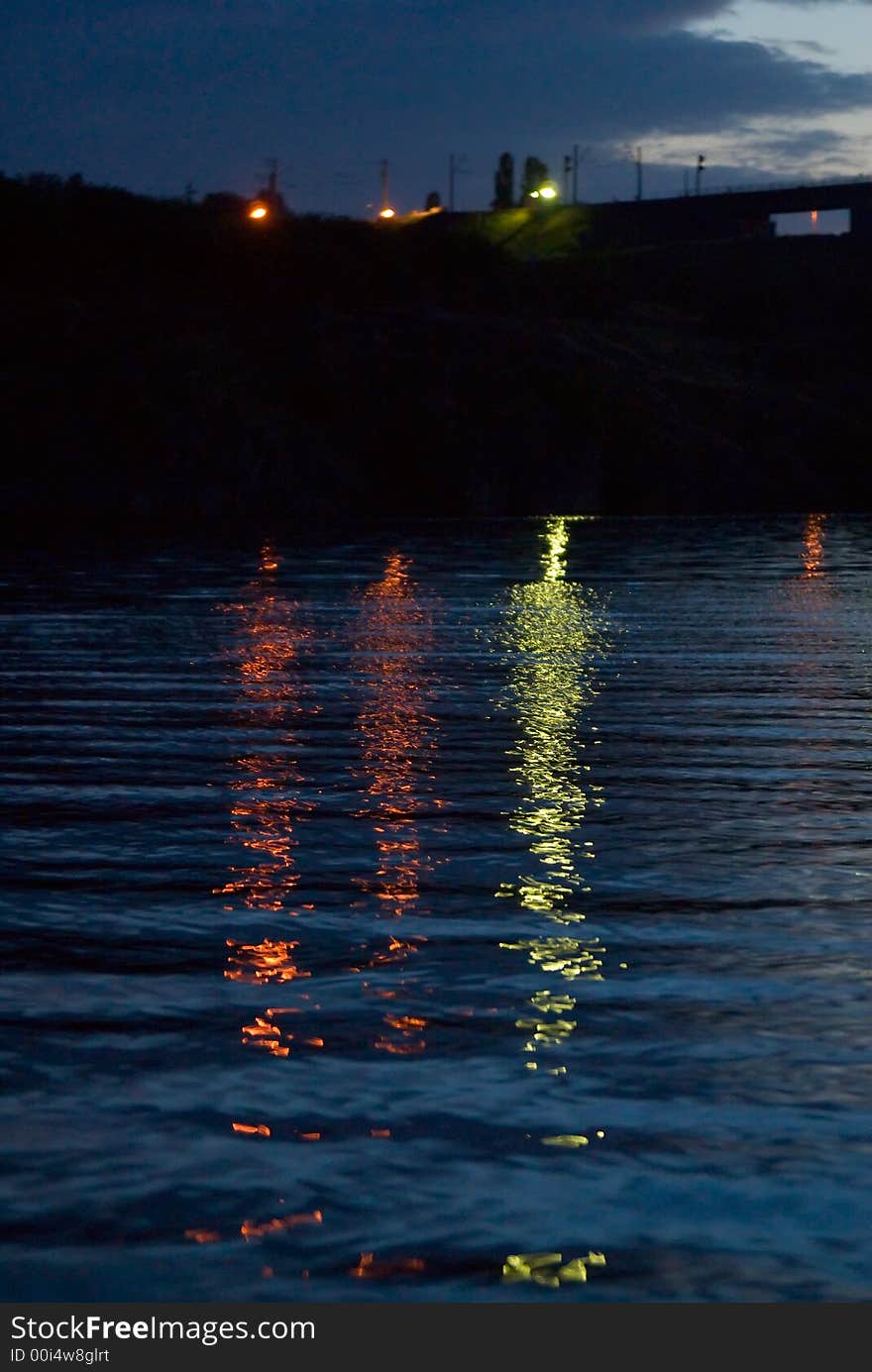 Citylights at night time reflecting in the water. Citylights at night time reflecting in the water