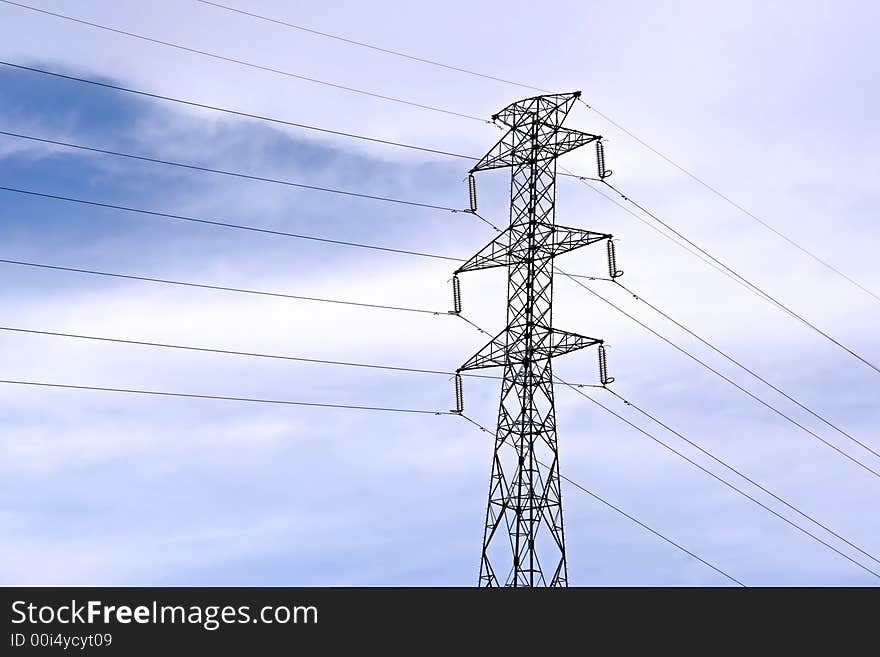 Antenna of communications with a sky with clouds as a background