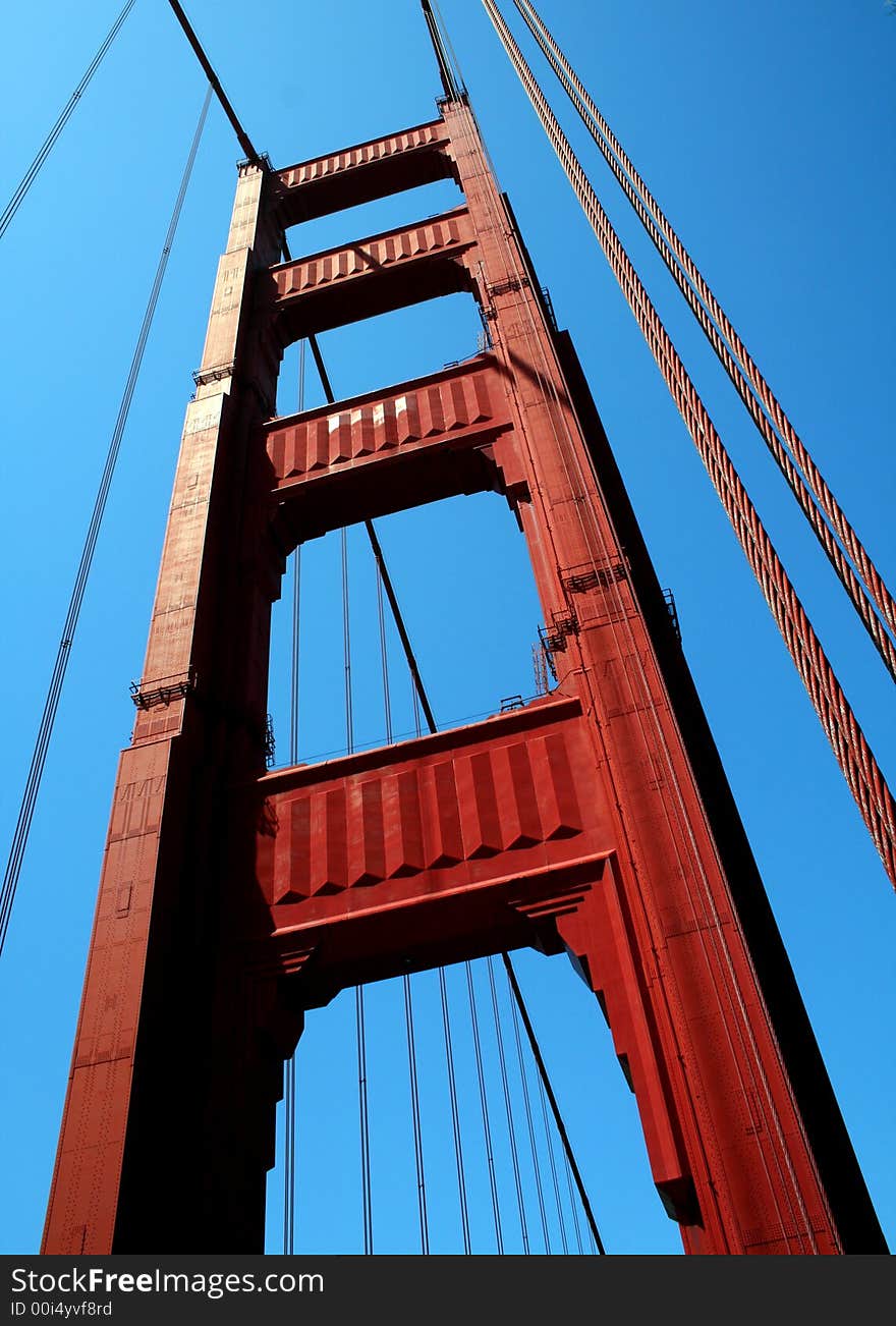 Looking up at a tower of the Golden Gate Bridge in San Francisco