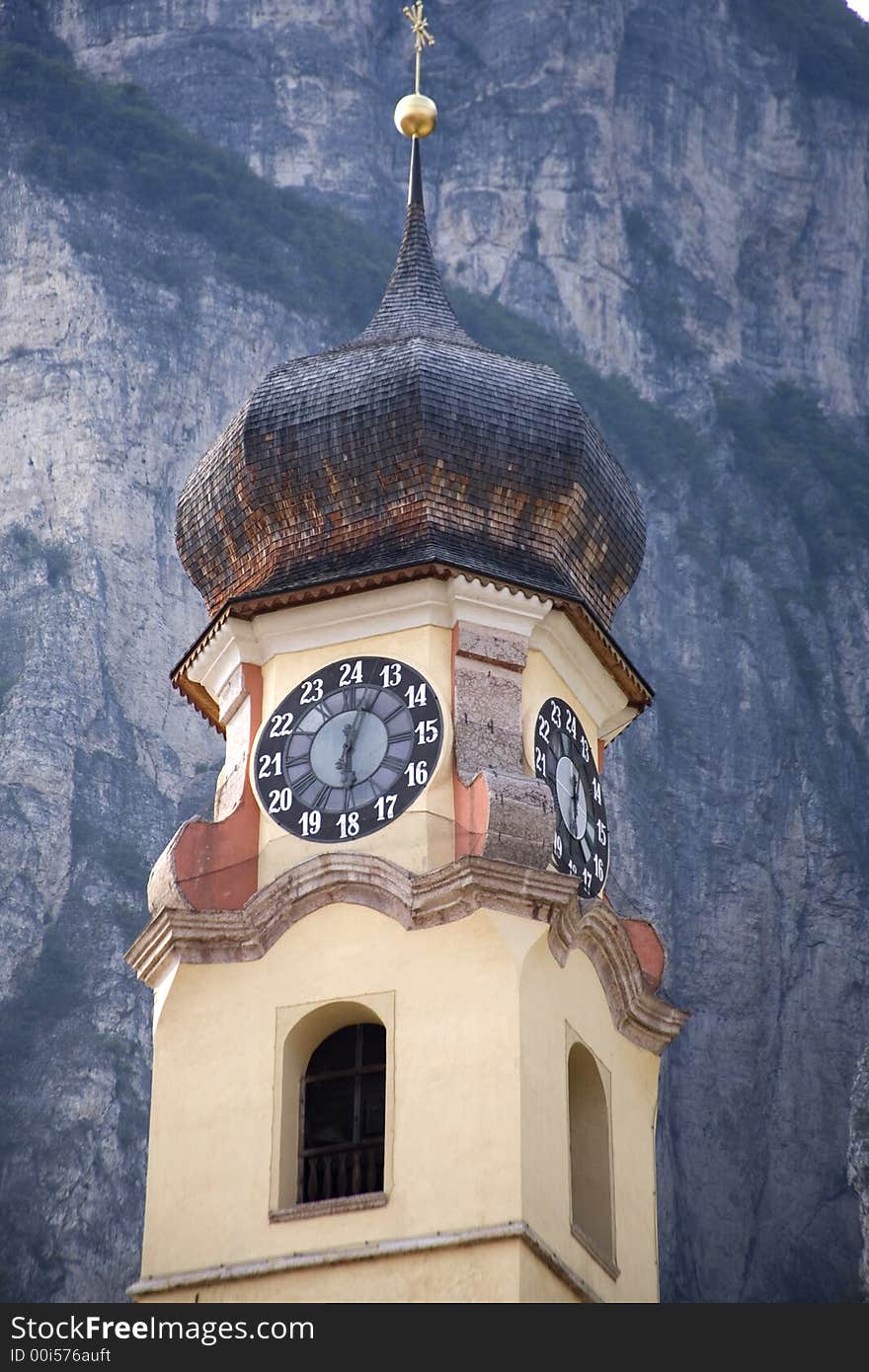 Church clock tower in the Italian alps. Church clock tower in the Italian alps