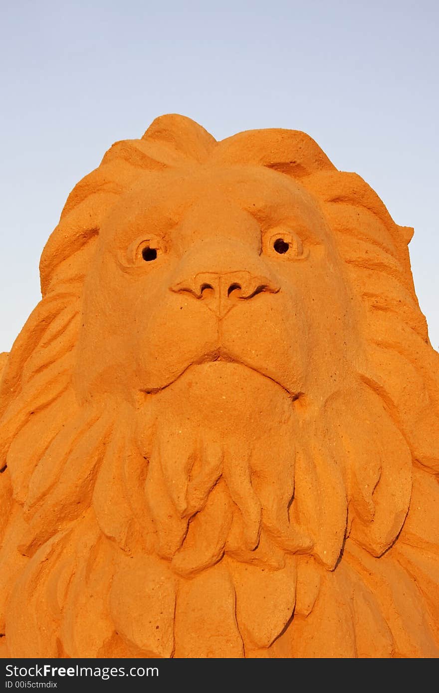 Lion Head Against A Blue Sky