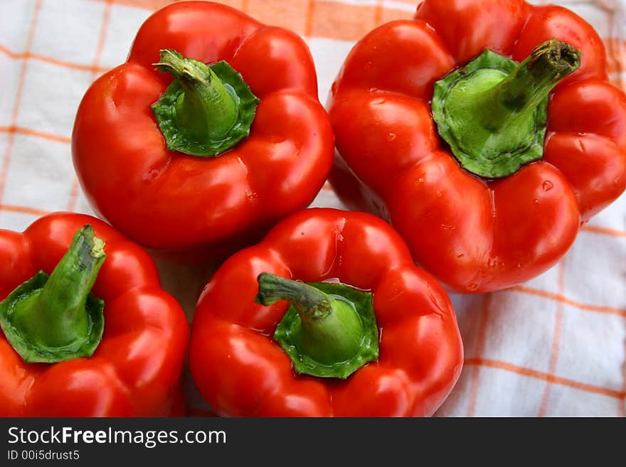 Four red peppers ready to cooking. Four red peppers ready to cooking