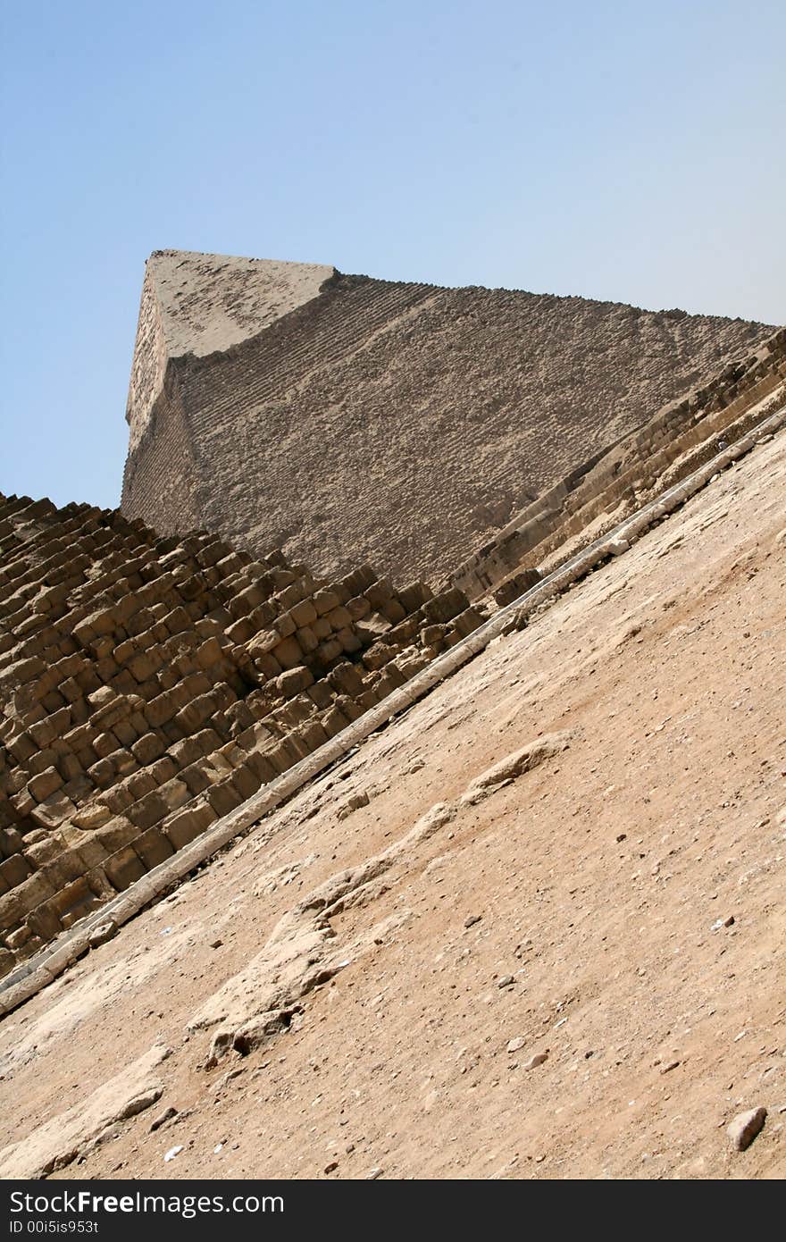 The great pyramids of Giza in Egypt, one pyramid is showing and part of anotehr one. Shot with an angle to give a different feeling. The great pyramids of Giza in Egypt, one pyramid is showing and part of anotehr one. Shot with an angle to give a different feeling...