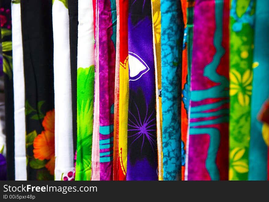 An abstract photograph of different textures of cloth and material on sale. Their individual patterns and colours exuding a colourful variation across the frame. An abstract photograph of different textures of cloth and material on sale. Their individual patterns and colours exuding a colourful variation across the frame