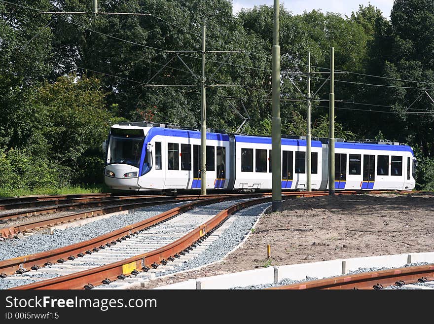 Fast tram on railway tracks. Fast tram on railway tracks