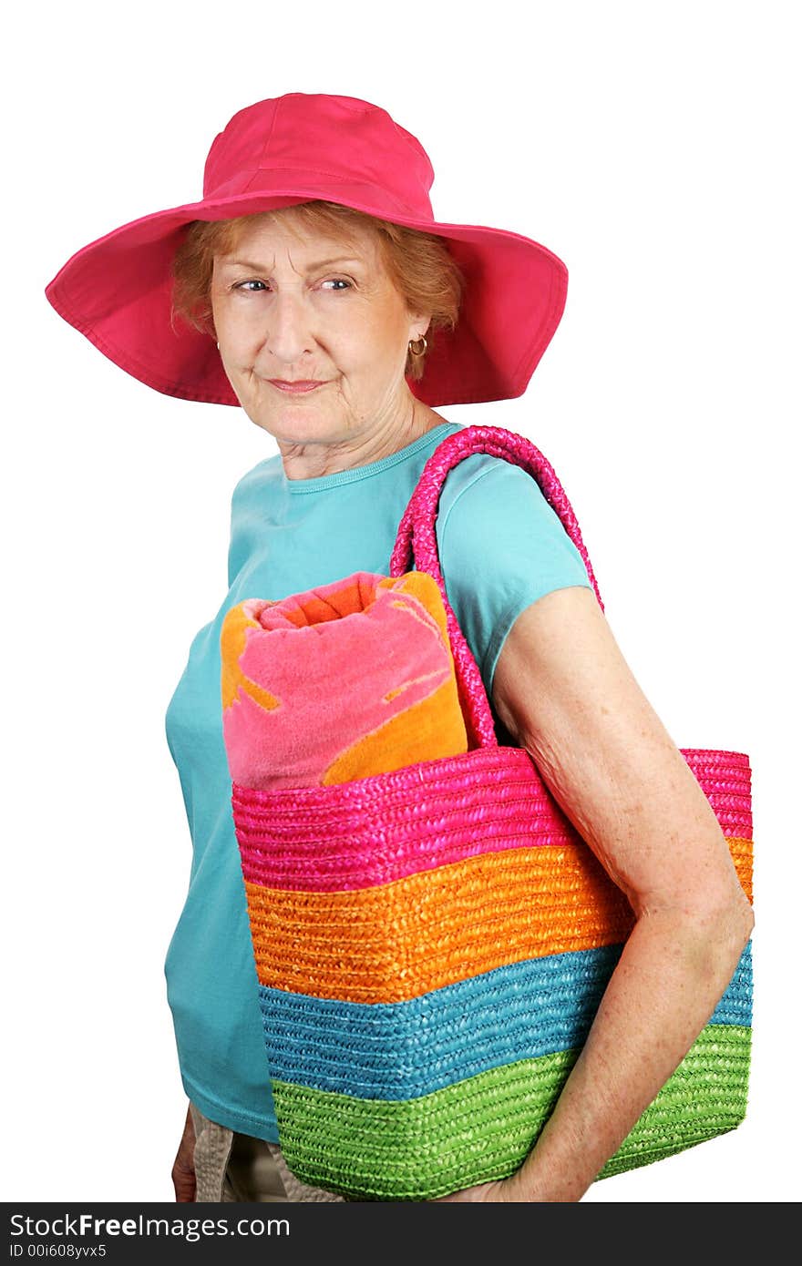 A senior dressed for the beach looking back over her shoulder. Isolated on white. A senior dressed for the beach looking back over her shoulder. Isolated on white.