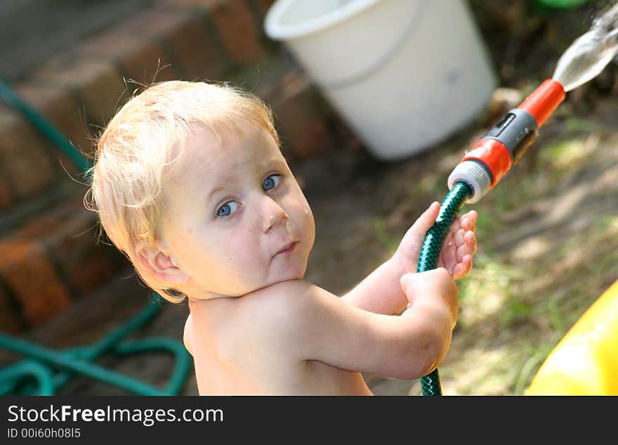 Young boy is playing in the garden. Young boy is playing in the garden