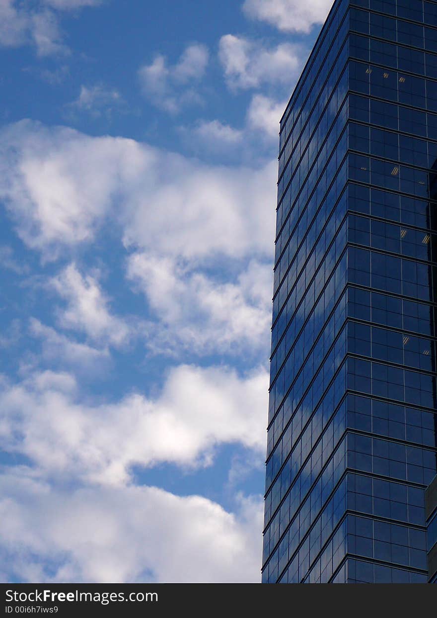 Reflections of clouds in the windows of an office building. Reflections of clouds in the windows of an office building