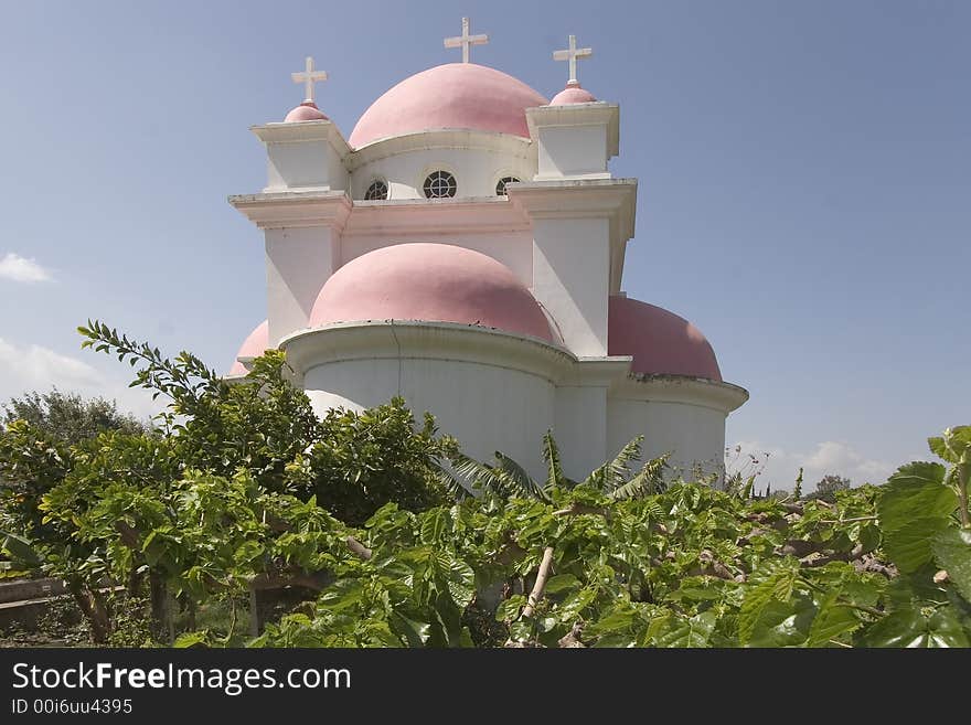 Orthodox church on coast of the lake of Tiberias, shined by the sun, a church garden and a vineyard. Orthodox church on coast of the lake of Tiberias, shined by the sun, a church garden and a vineyard