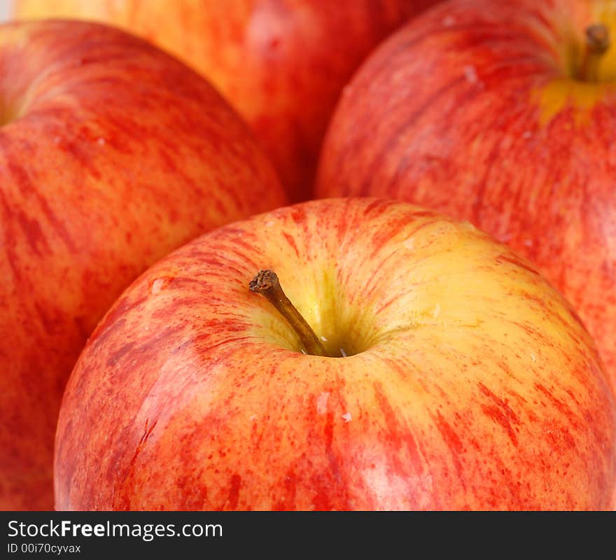 A closeup of four ripe Gala apples. A closeup of four ripe Gala apples