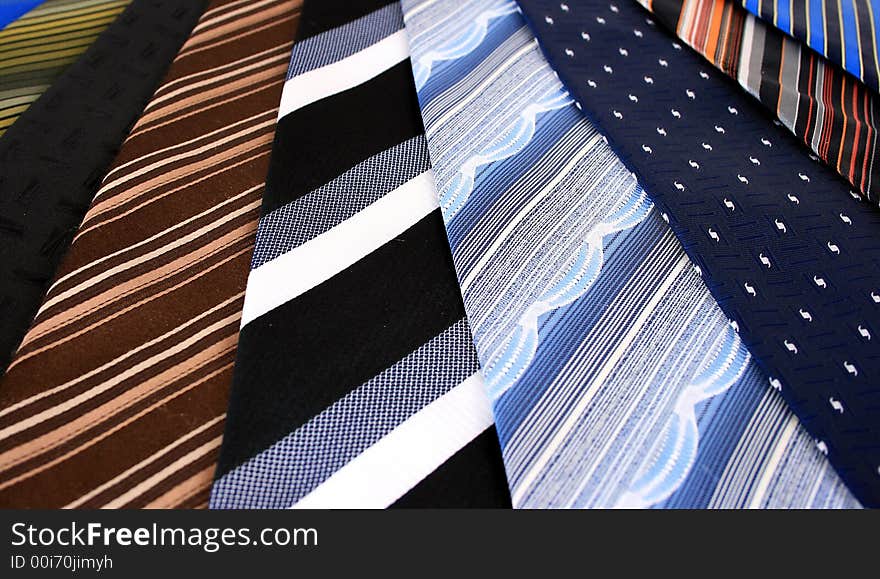 Lots of ties isolated over white.