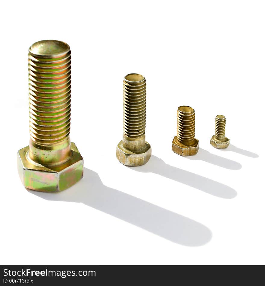 Four bolts of the different size on a white background