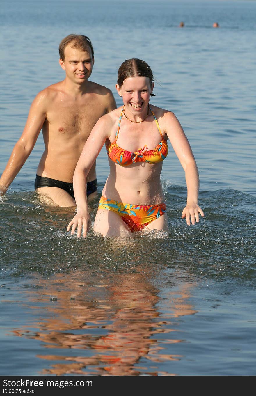 Couple having fun in water