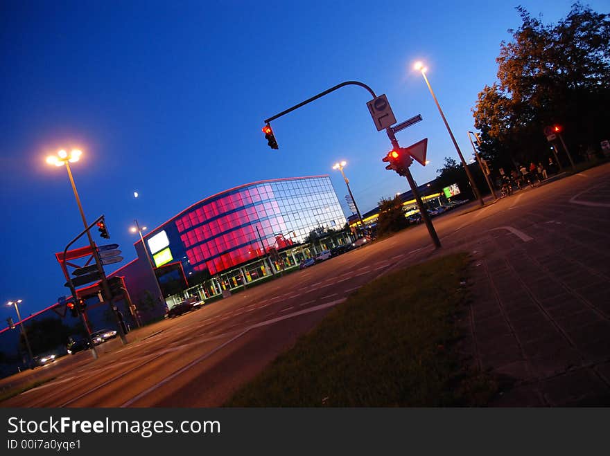 Street and colorful building at night in angular persepective. Street and colorful building at night in angular persepective