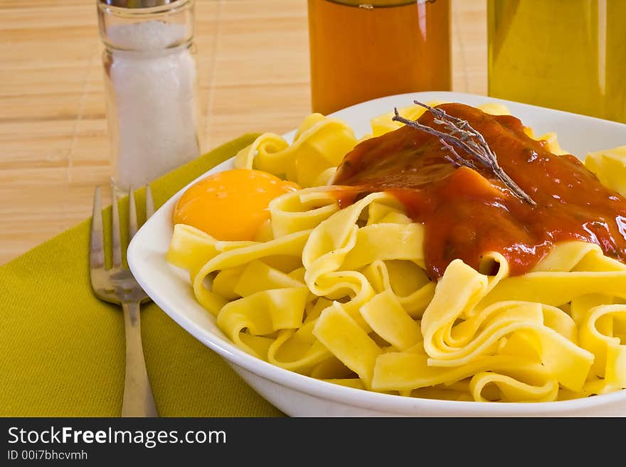 Italian food pasta with tomato sauce on white bowl. Italian food pasta with tomato sauce on white bowl