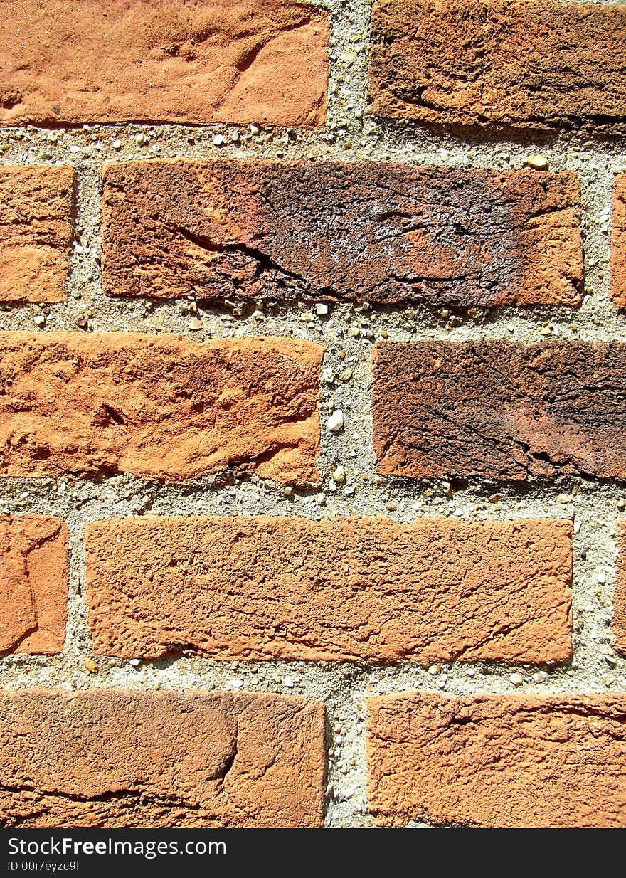 A close up photograph of a brick wall. A close up photograph of a brick wall.