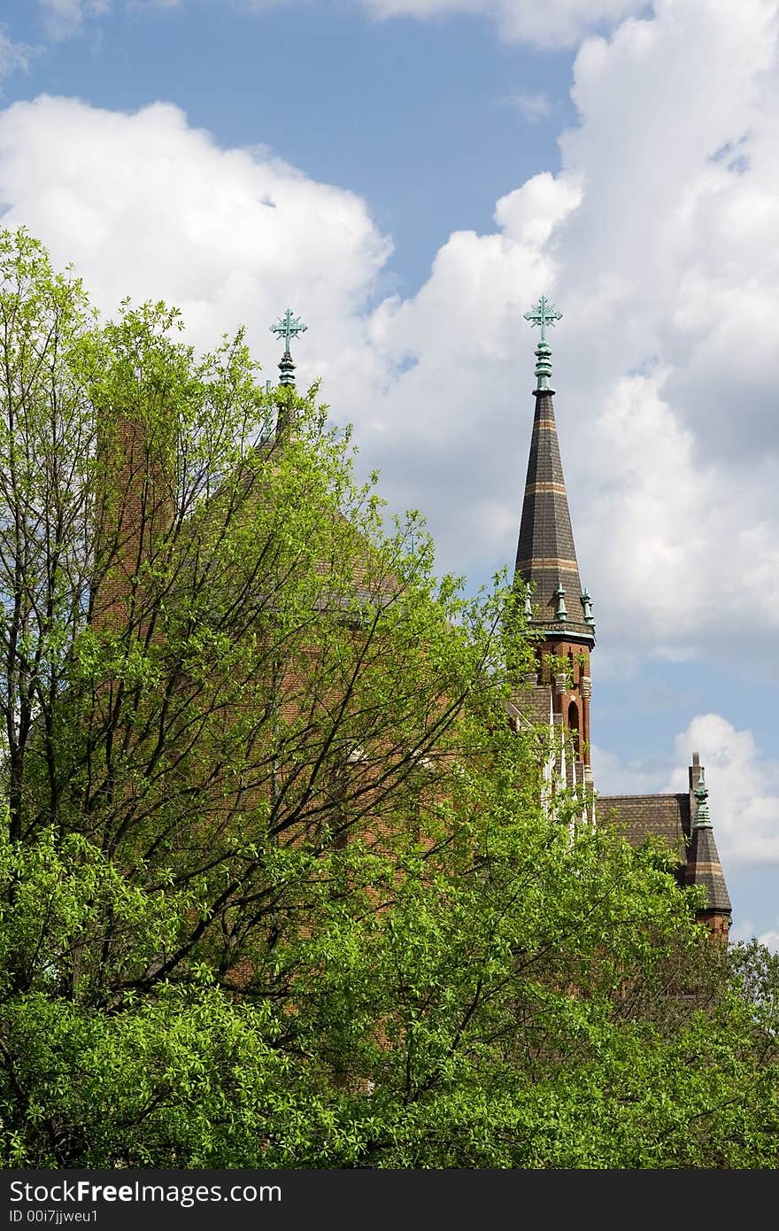 The steeples of a Catholic Church rising into the sky. The steeples of a Catholic Church rising into the sky.