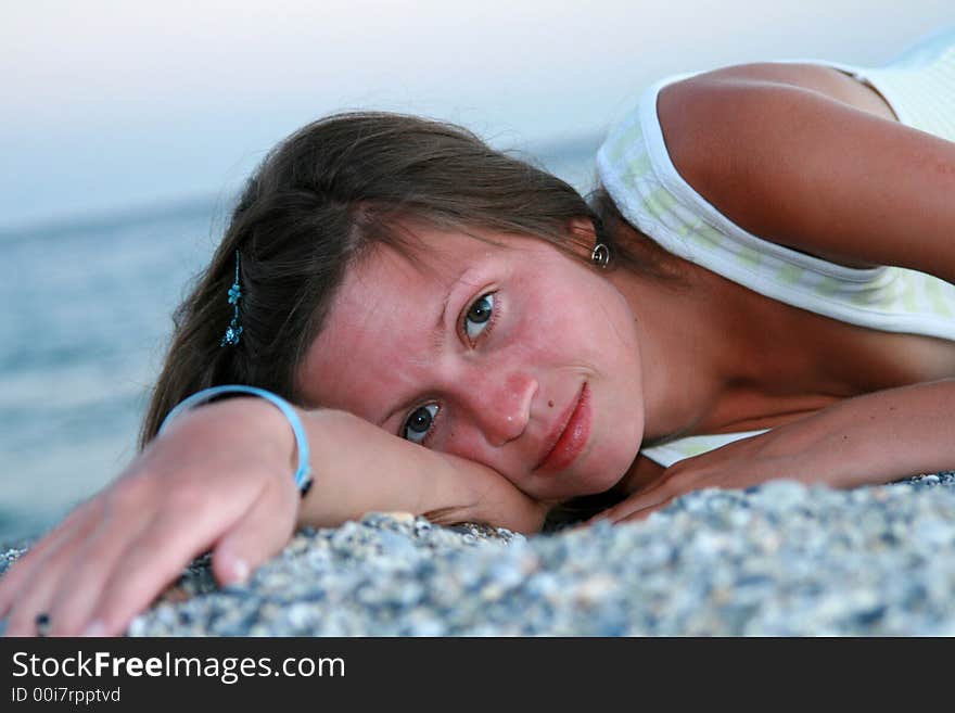 Young woman lying on beach