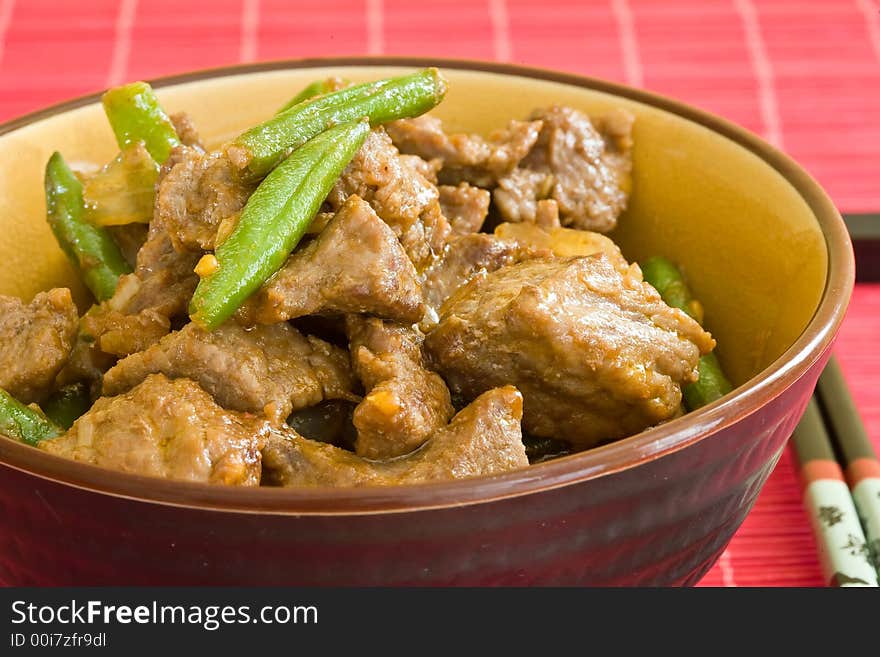 Asian food of beef and vegetables on brown bowl. Asian food of beef and vegetables on brown bowl