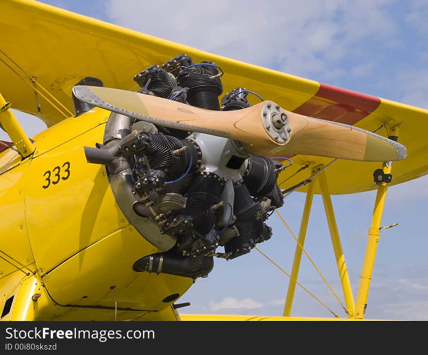 Yellow oldtime airplane with a wooden Propeller. Yellow oldtime airplane with a wooden Propeller