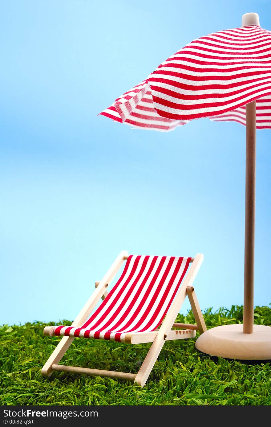 Sunshade and beach chair on the meadow. Sunshade and beach chair on the meadow