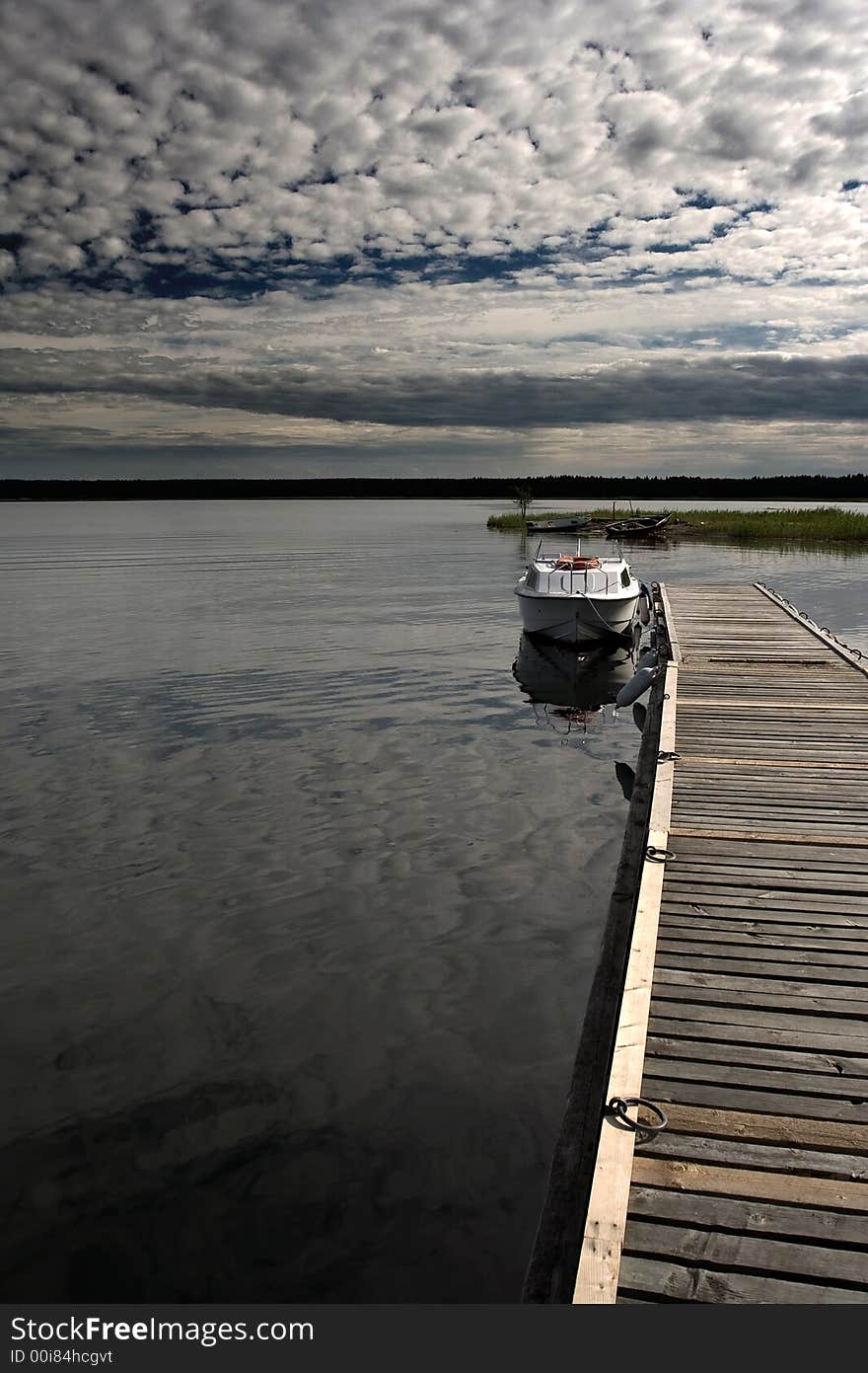 Single, alone boat at the baltic sea coast.