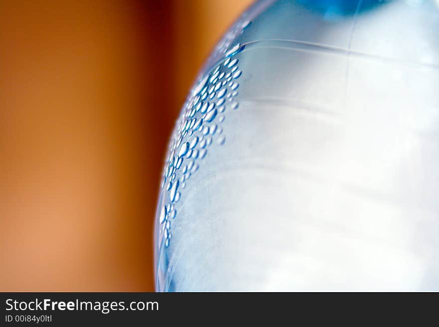 Close-up of bottle with water droplets.