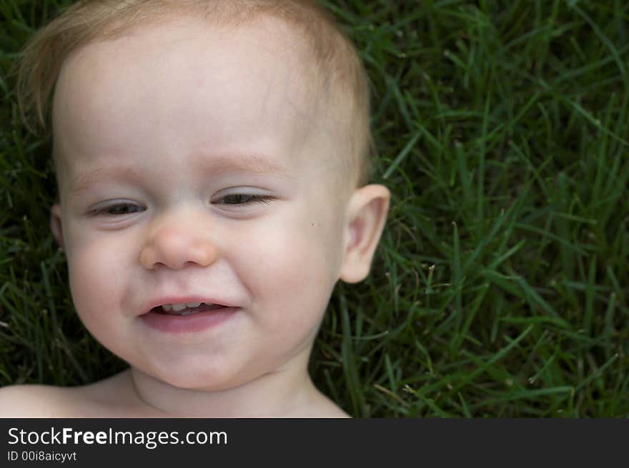 Laughing Toddler in Grass