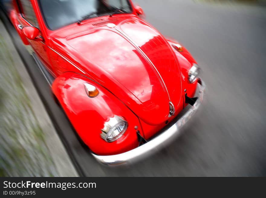 Rclassic red car with blur