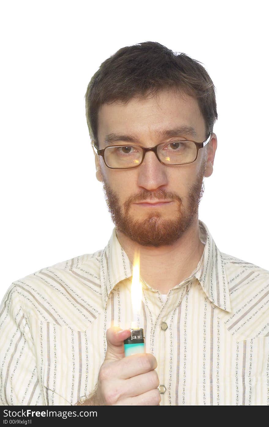 Man with beard turning on a lighter with a large flame against a white background. Man with beard turning on a lighter with a large flame against a white background.