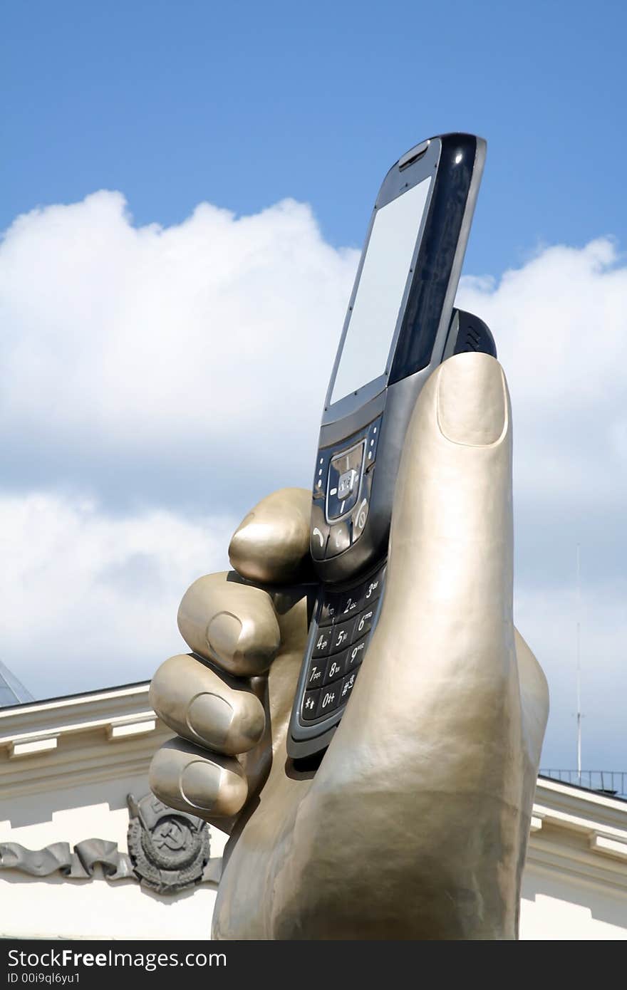 Statue of hand with mobile phone