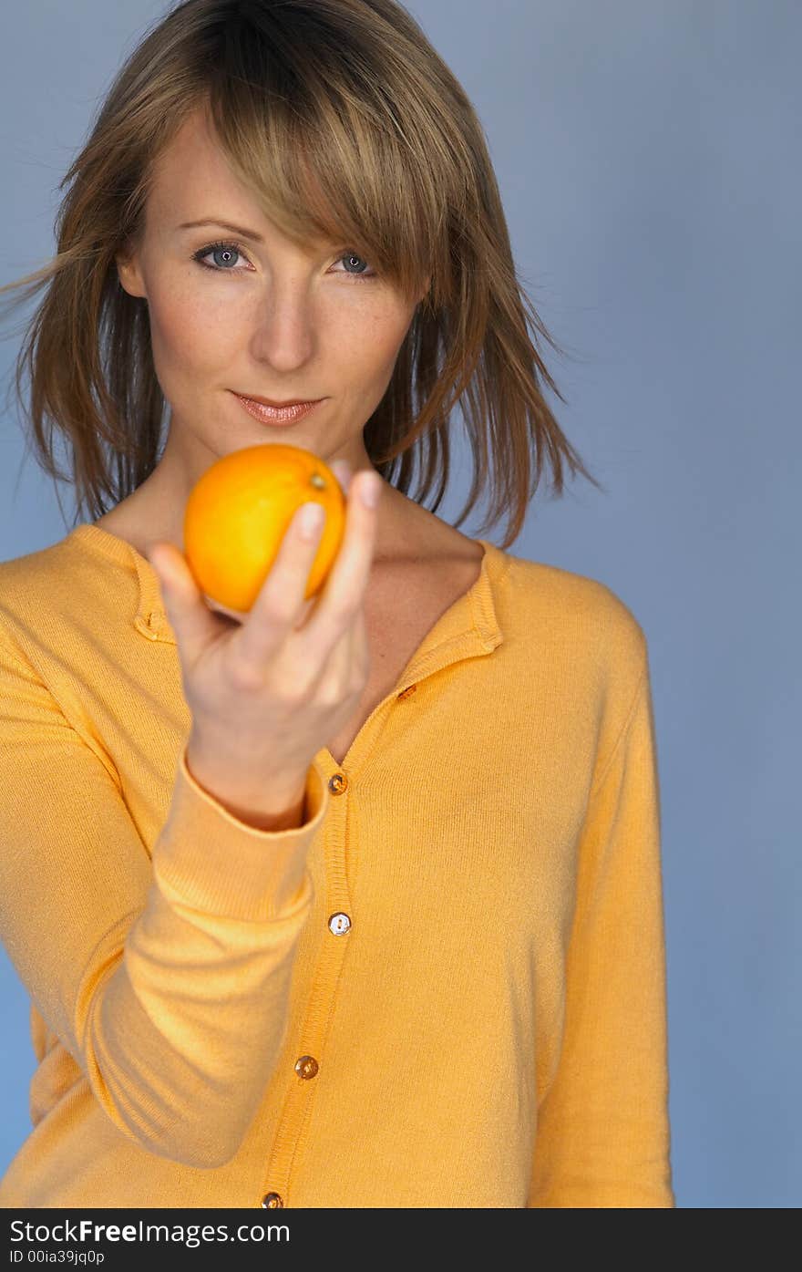 Portrait of woman with  orange