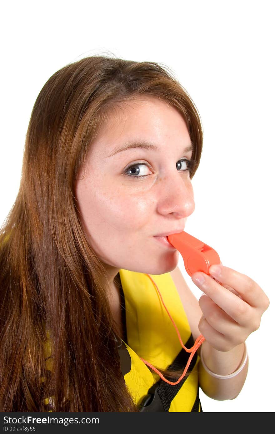 Teenager portrait with yellow llifejacket and orange safety whistle shot over white