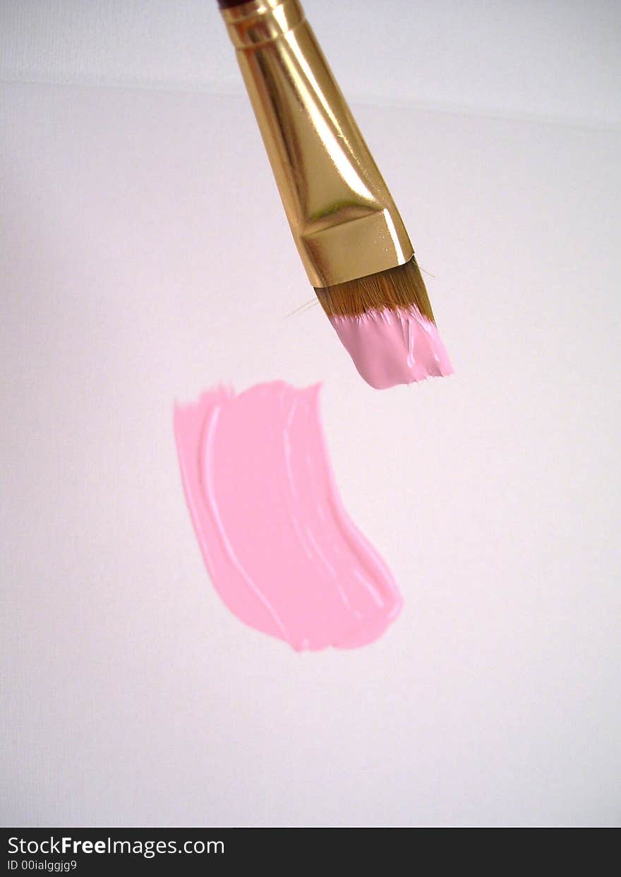 Brush in pink colors with fresh stroke on the canvas