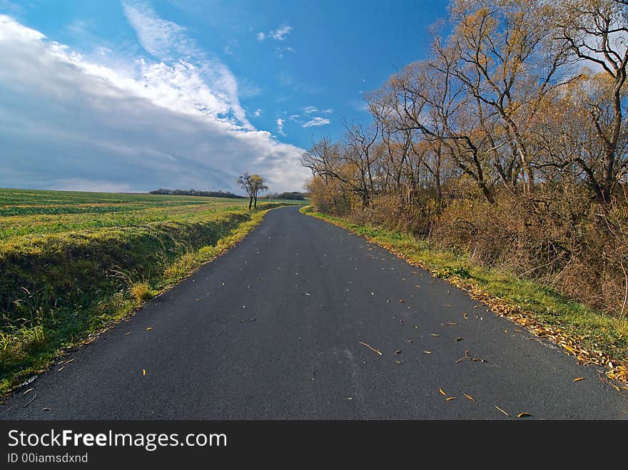 Photo of the rural road visually leaving for horizon. Photo of the rural road visually leaving for horizon.