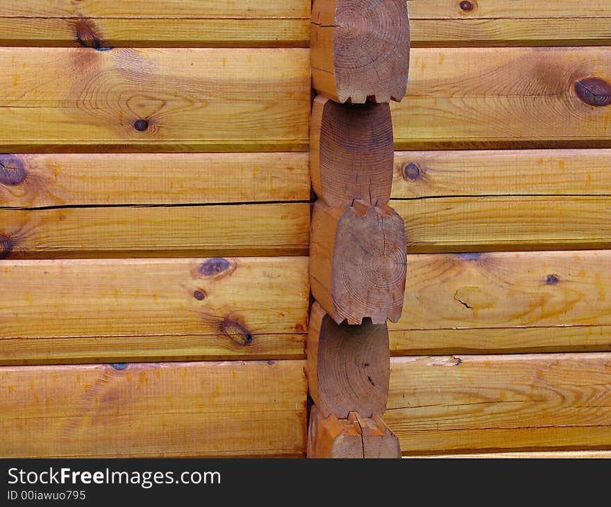 Details of a corner of a house made with wood logs. Details of a corner of a house made with wood logs