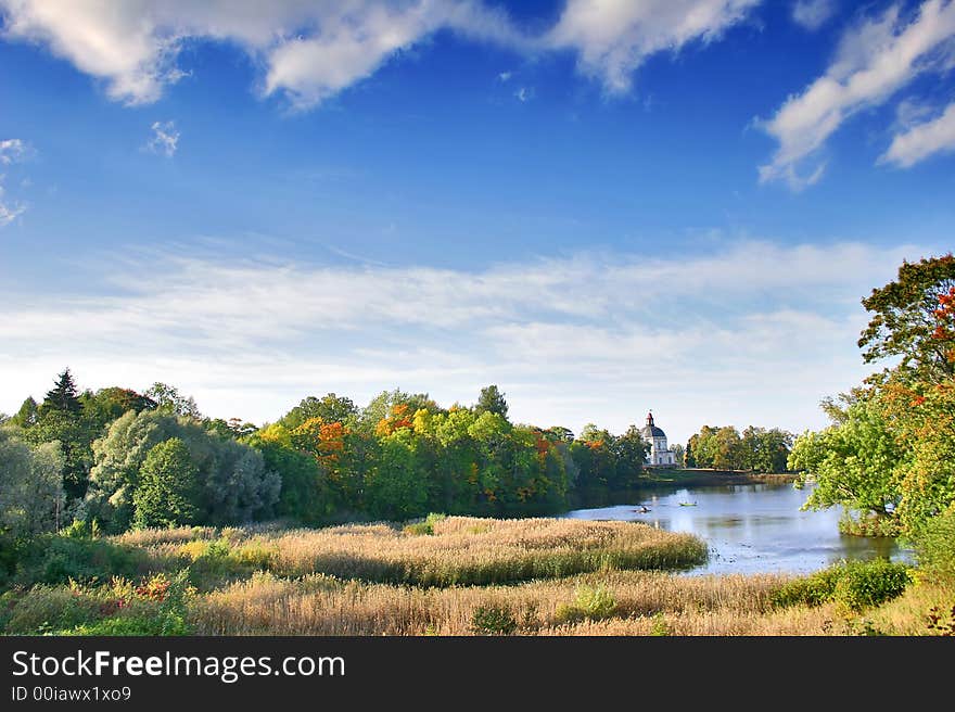 Autumn landscape with blue sky, trees and pond. Autumn landscape with blue sky, trees and pond