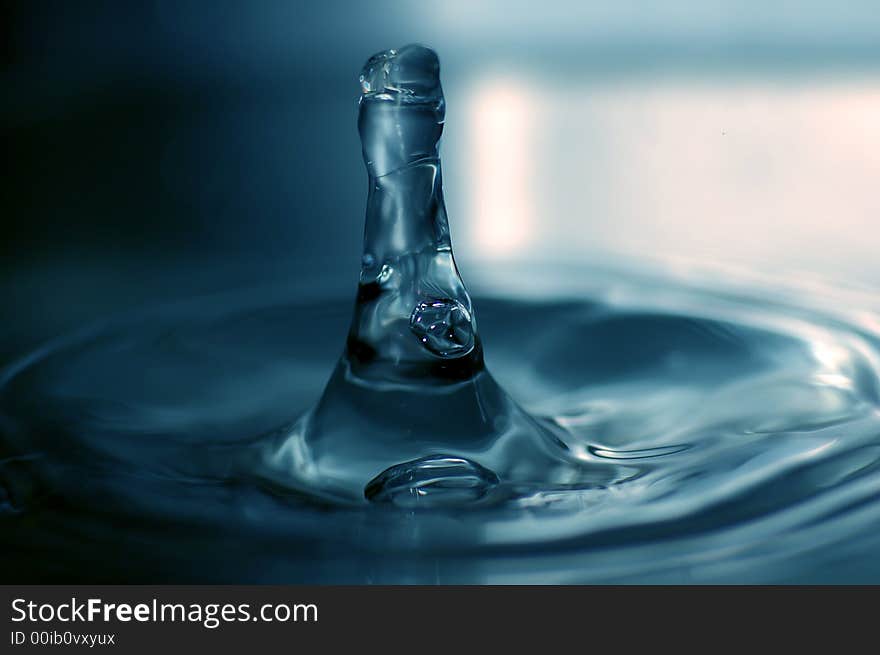 Close-up of big water drop on blue background. Close-up of big water drop on blue background