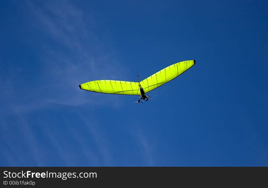 Green glider and blue sky. Green glider and blue sky.