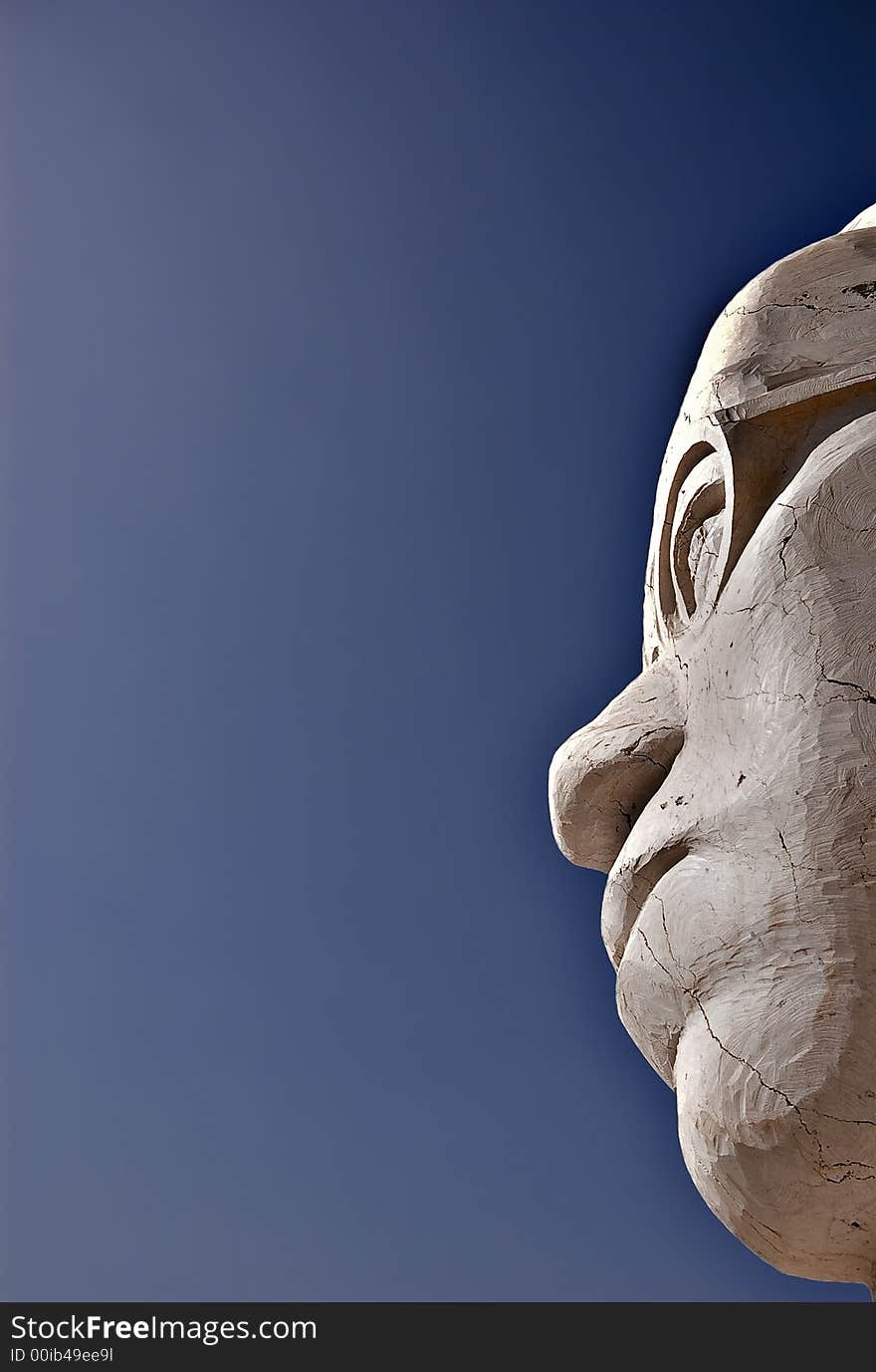 A face of stone cracked head. A face of stone cracked head