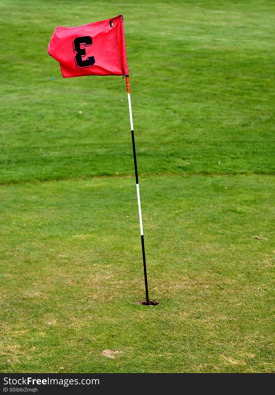 Golf field with red flag. Golf field with red flag.