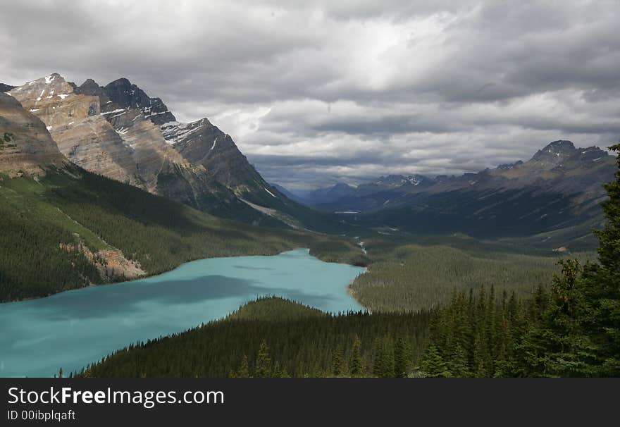 Aqua waters of scenic Bow Lake shimmer in the bright sunlight. Aqua waters of scenic Bow Lake shimmer in the bright sunlight