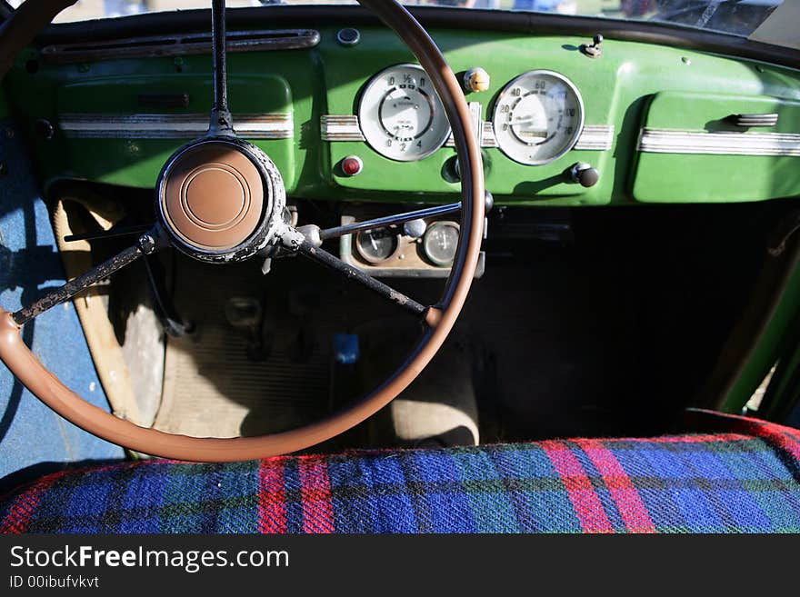 View of the interior of an old vintage car. View of the interior of an old vintage car