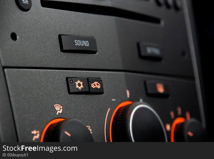 A car radio with light orange buttons